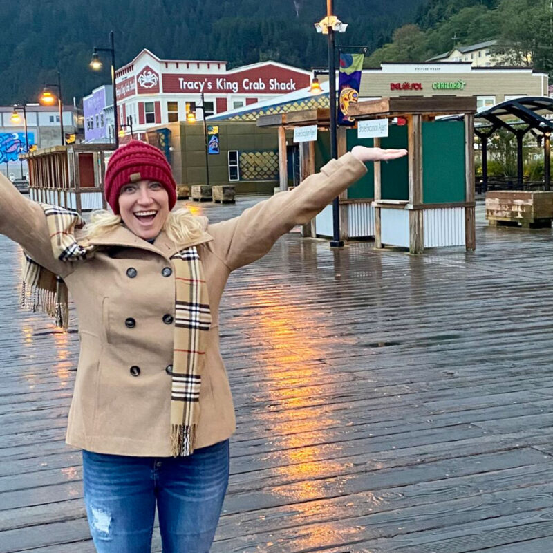 Lynne with Outstretched Arms on a Boardwalk