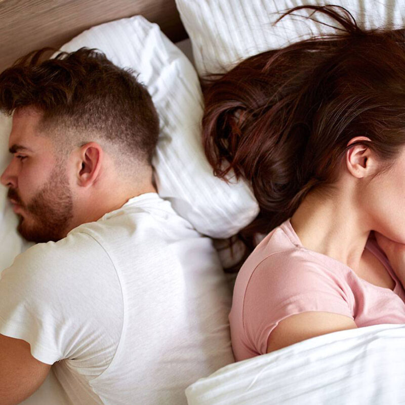 Frustrated couple in bed