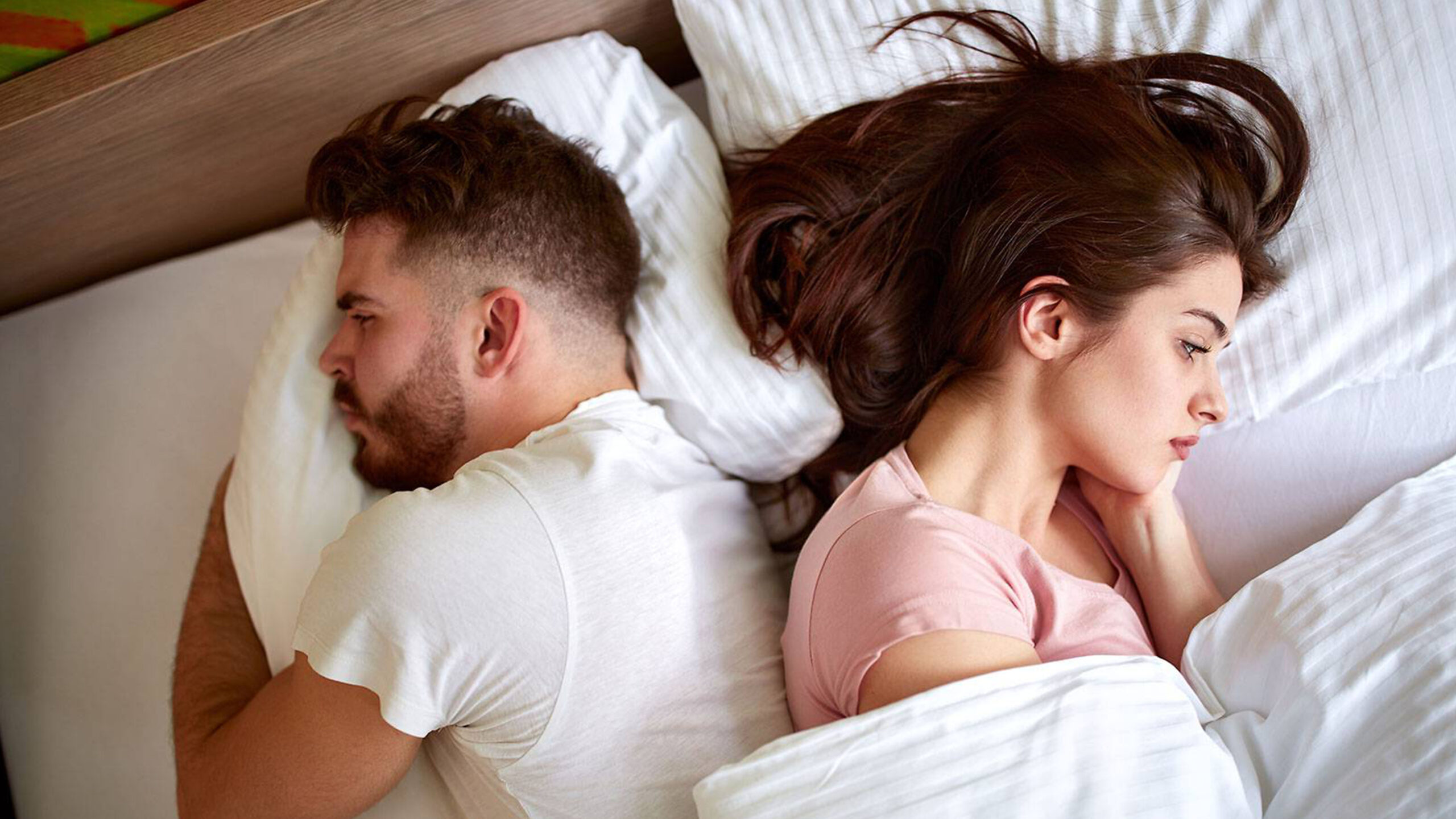 Frustrated couple in bed