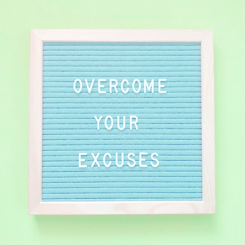 Sign with the text "Overcome Your Excuses"