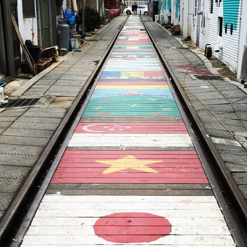 Artistic Alley with Old Trolley Tracks in the Middle