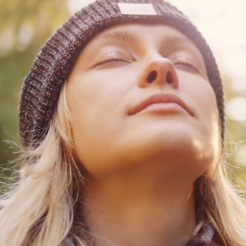 Woman with Eyes Closed Enjoying the Sun on Her Face