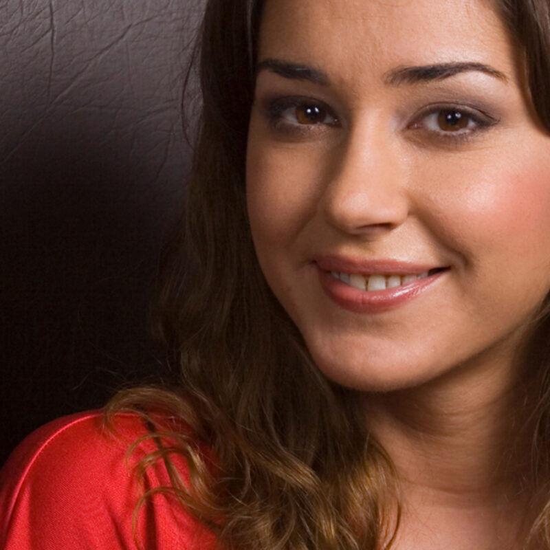 Young Woman in Red Top Smiling